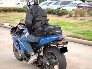 Photo of tail bag on bike - guy on motorcycle shot from behind