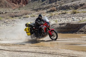 Africa Twin fully loaded with waterproof luggage in yellow